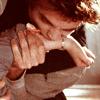 Edward biting Bella's arm.